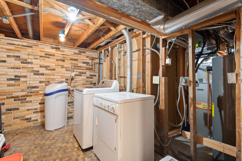 modern 50-gallon electric water heater installed in utility room