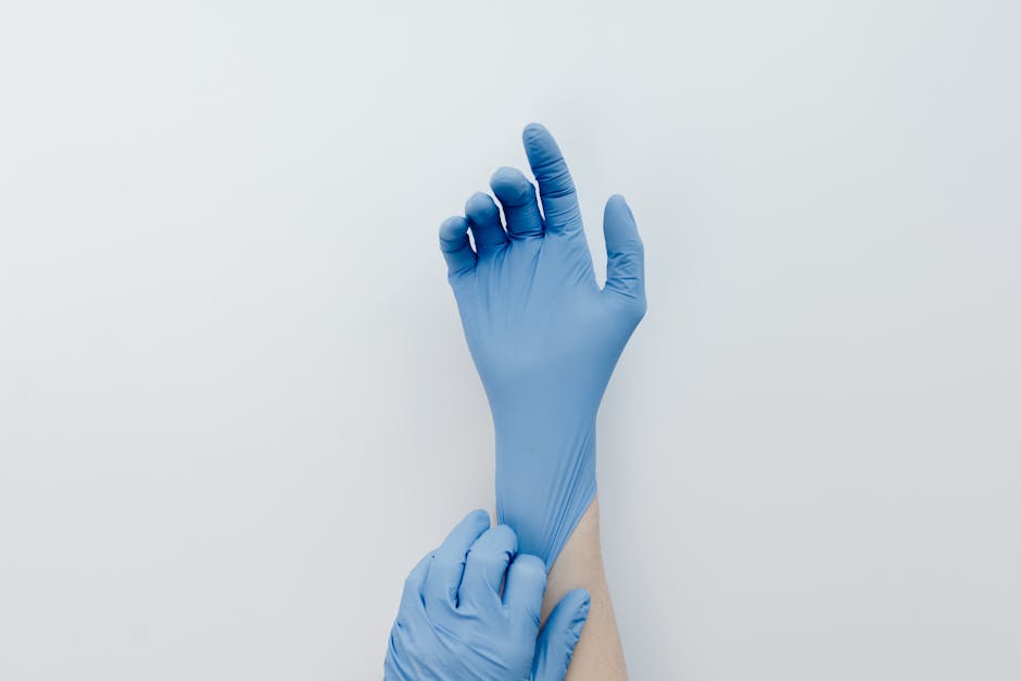 plumber wearing nitrile gloves and safety glasses
